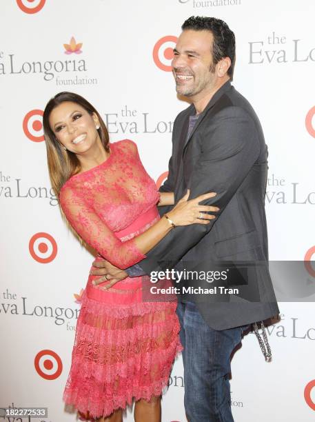 Eva Longoria and Ricardo Chavira arrive at The Eva Longoria Foundation Dinner held at Beso on September 28, 2013 in Hollywood, California.