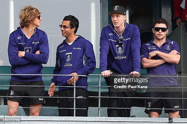 Nathan Fyfe, Danyle Pearce, Zac Dawson and Hayden Ballantyne look on while the team is introduced to supporters during the Fremantle Dockers Fan Day...