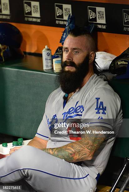 Pitcher Brian Wilson of the Los Angeles Dodgers looks on from the dugout during the six inning against the San Francisco Giants at AT&T Park on...