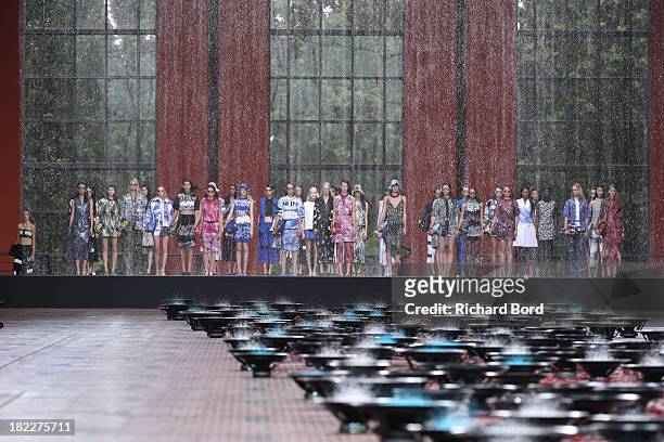 Models stand on the runway during the Kenzo show at 'Cite du Cinema' of Saint-Denis as part of the Paris Fashion Week Womenswear Spring/Summer 2014...