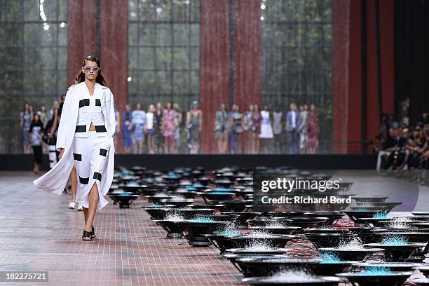 Model walks the runway during the Kenzo show at 'Cite du Cinema' of Saint-Denis as part of the Paris Fashion Week Womenswear Spring/Summer 2014 on...