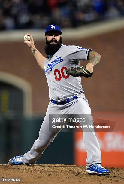 Brian Wilson of the Los Angeles Dodgers pitches in the eighth inning against the San Francisco Giants at AT&T Park on September 24, 2013 in San...