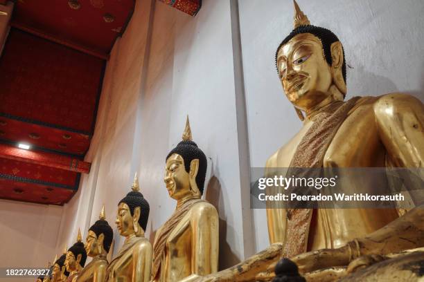 golden buddhas in serene temple setting - chan buddhism stock pictures, royalty-free photos & images