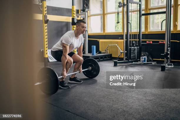 young man weightlifting - deadlift stock pictures, royalty-free photos & images