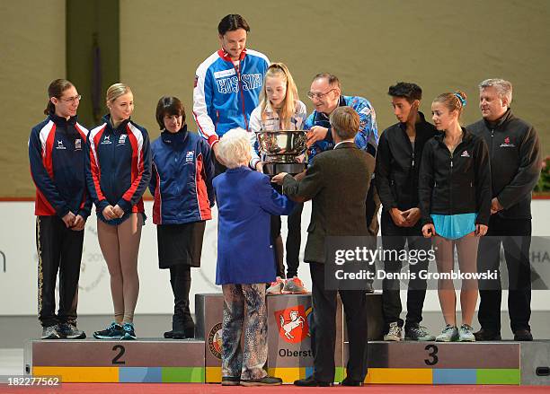 The teams of the United States, Russia and Canada are honoured with the Fritz Geiger award during day three of the ISU Nebelhorn Trophy at...