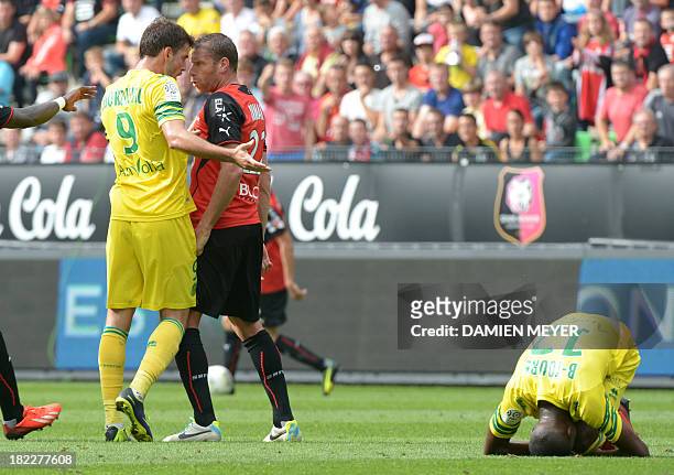 Nantes' Serbian forward Filip Djordjevic argues with Rennes' French defender Sylvain Armand during the French L1 football match Rennes against Nantes...