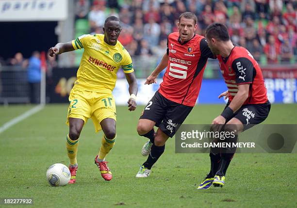 Nantes' French defender Issa Cissokho vies with Rennes' French defender Sylvain Armand and Rennes' French forward Romain Alessandrini during the...
