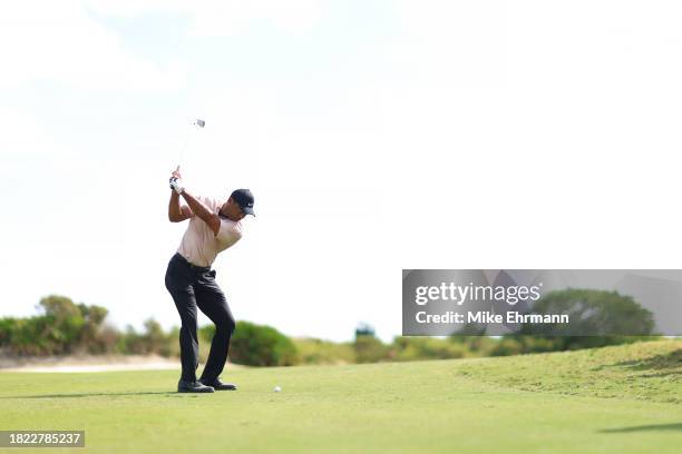 Tiger Woods of the United States plays a shot on the fourth hole of the United States plays a shot on the fourth hole during the first round of the...