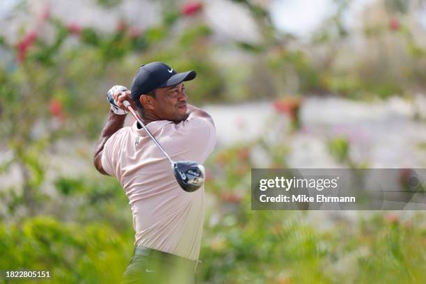 Tiger Woods of the United States plays his shot from the fourth tee during the first round of the Hero World Challenge at Albany Golf Course on...