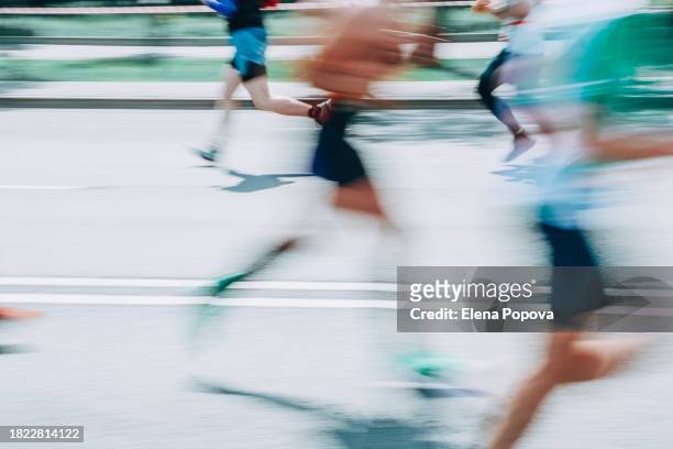 low section amateur people running fast in the city, blurred motion abstract sports background - low motivation stock pictures, royalty-free photos & images