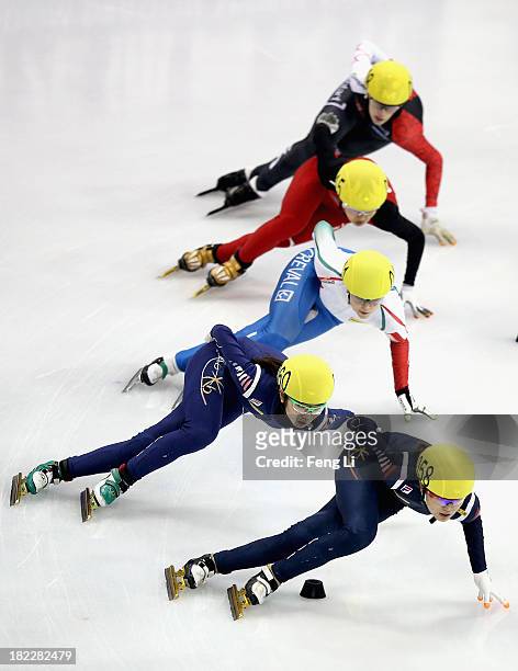 Shim Suk Hee and Kim Alang of Korea, Arianna Fontana of Italy, Li Jianrou of China and Marianne St-Gelais of Canada compete in the Women's 1000m...