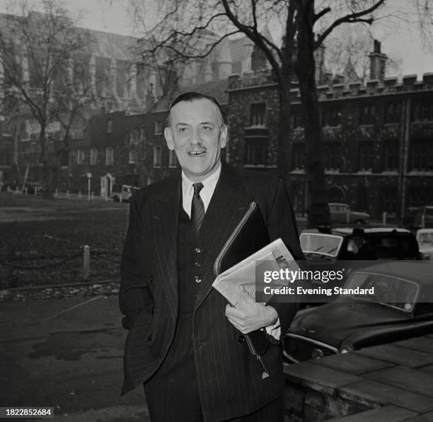 Bank of England director and financier Hugh Kindersley , outside Church House, Westminster, during the Bank Rate Tribunal, London, December 1957. )