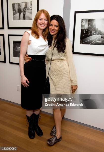 Actresses Alicia Witt and Zuleikha Robinson attend the opening of musician Ben Folds' photo exhibition "Between The Notes" at Gallery 169 on...