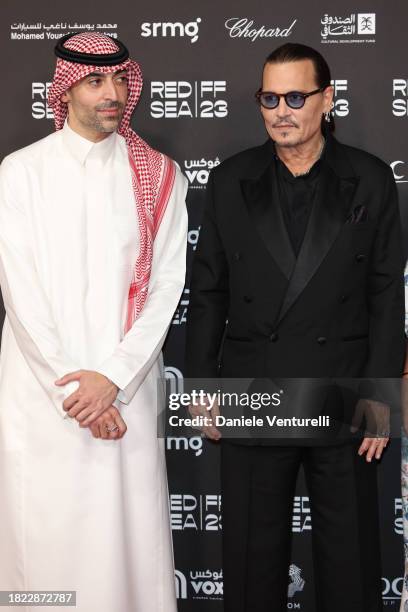 Ceo of the Red Sea International Film Festival Mohammed Al Turki and Johnny Depp attend the Opening Night screening of "HWJN" at the Red Sea...