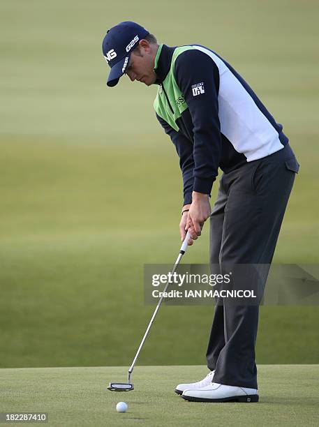 English golfer Tom Lewis plays a putt during the final day of The Alfred Dunhill Links Championships golf competition on The Old Course at St...