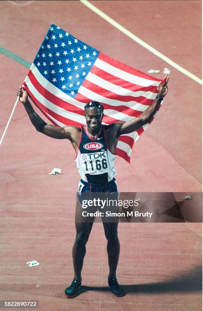 Allen Johnson of the USA celebrates winning the Men's 110m hurdles at The 6th IAAF World Athletics Championships at the Olympic Stadium on August...