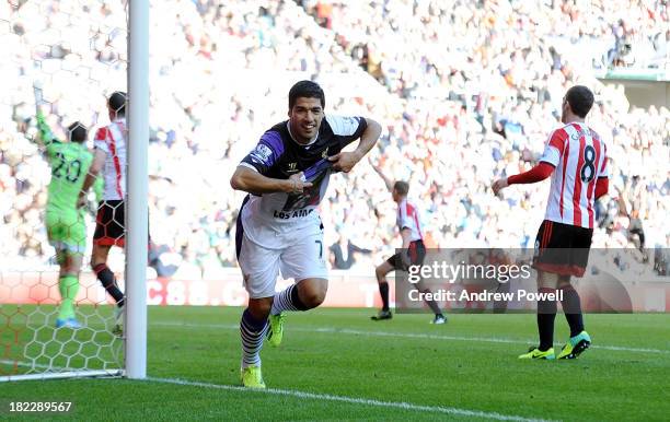 Luis Suarez of Liverpool celebrates after scoring the second goal during the Barclays Premier League match between Sunderland and Liverpool at...