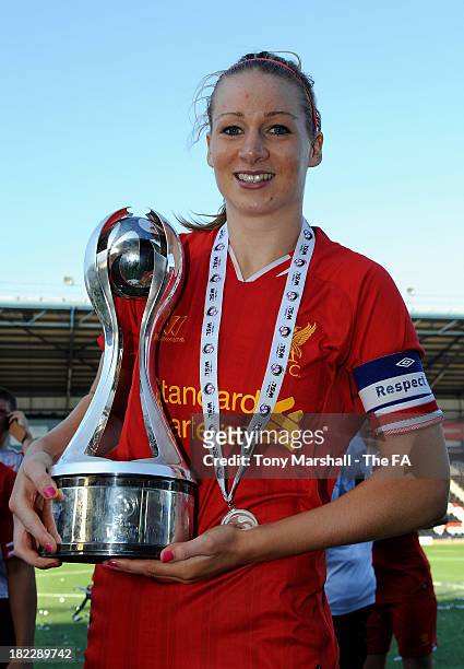 Gemma Bonner of Liverpool celebrates with the trophy after Liverpool win the FA Women's Super League during the Women's Super League match between...