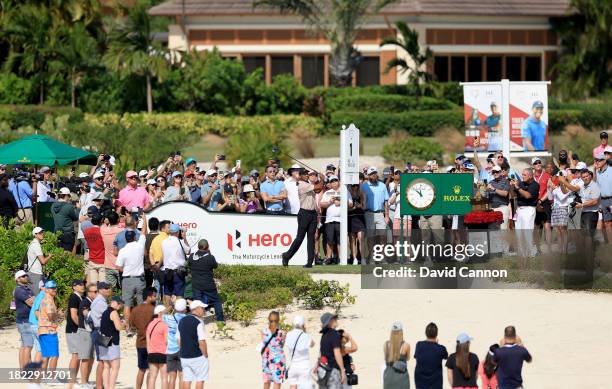 Tiger Woods of The United States plays his tee shot on the first hole during the first round of the Hero World Challenge at Albany Golf Course on...