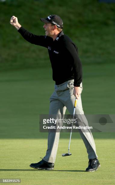 David Howell of England celebrates after holing his putt on the 18th green during the second playoff hole against Peter Uihlein of the USA during the...