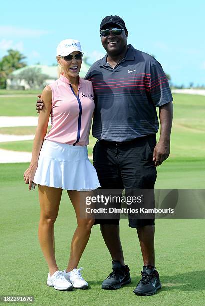 Gretchen Rossi and Rodney Peete attend the Golf Clinic with Greg Norman and Golf Tournament during Day Three of the Sandals Emerald Bay Celebrity...