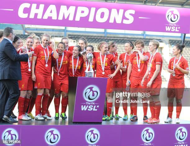 Liverpool Ladies players lift the trophy after winning the league following the FA Women's Super League match between Liverpool Ladies and Bristol...