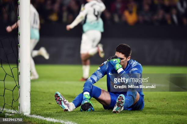 Cican Stankovic of AEK Athens looks dejected after Joao Pedro of Brighton & Hove Albion scores the team's first goal from the penalty spot during the...