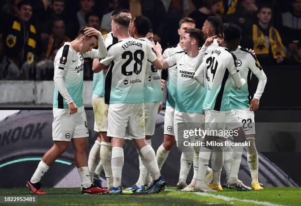 Joao Pedro of Brighton & Hove Albion celebrates with teammates after scoring the team's first goal from the penalty spot during the UEFA Europa...