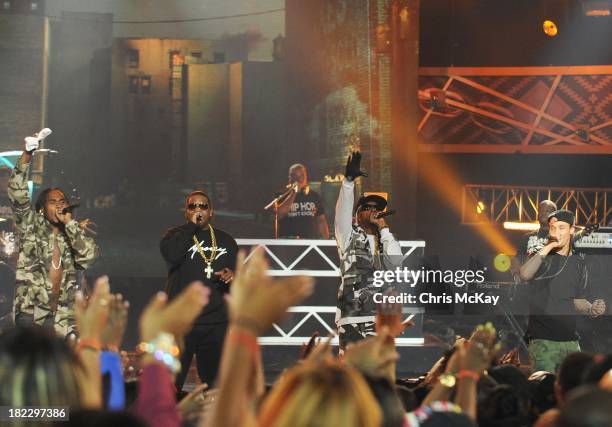 Krayzie Bone, Bizzy Bone, Wish Bone, and Flesh-N-Bone of Bone Thugs-N-Harmony perform during the BET Hip Hop Awards 2013 at the Boisfeuillet Jones...
