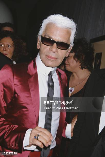 German fashion designer, artist and photographer Karl Lagerfeld at the Art Basel party being held at the Mynt Lounge, Miami, 2002.