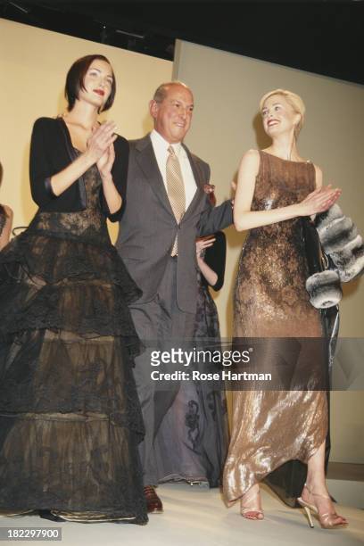 Fashion designer Oscar de la Renta and New Zealand-born model and actress Kylie Bax on the catwalk at the Oscar de la Renta Fall 1997 Collection...