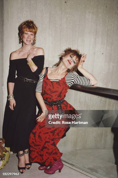 American fashion designer Betsey Johnson and business partner Chantal Bacon strike a pose, circa 1988.