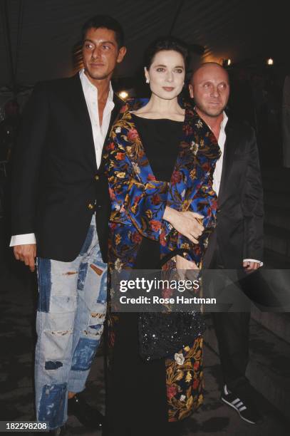 Italian fashion designers Domenico Dolce and Stefano Gabanna with Italian actress Isabella Rossellini at the Metropolitan Museum Gala, New York City,...