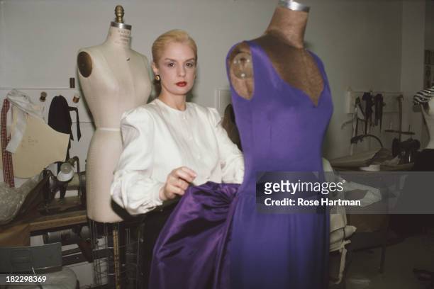 Venezuelan-American fashion designer Carolina Herrera at work in her East 57th Street studio, New York City, May 1987.