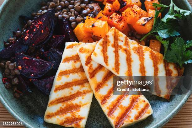 pumpkin, grilled halloumi, beet, and lentil bowl - grilled halloumi stock pictures, royalty-free photos & images