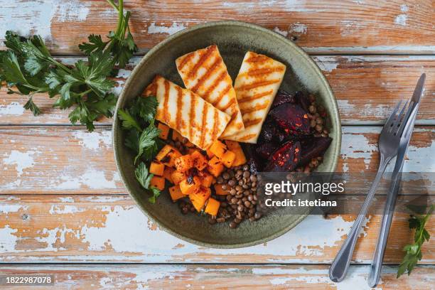 pumpkin, grilled halloumi, beet, and lentil bowl - grilled halloumi stock pictures, royalty-free photos & images