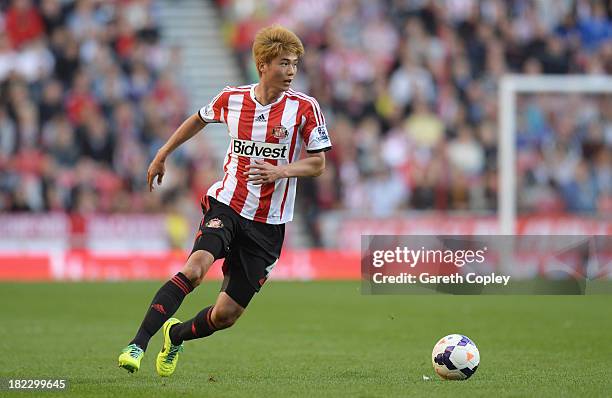 Ki Sung-Yueng of Sunderland in action during the Barclays Premier League match between Sunderland and Liverpool at the Stadium of Light on September...