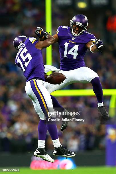 Wide receiver Greg Jennings of the Minnesota Vikings celebrates with teammate wide receiver Joe Webb of the Minnesota Vikings after scoring a 70yd...