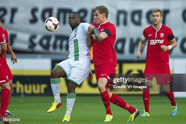 Genero Zeefuik of FC Groningen, Andreas Bjelland of FC Twente, Rasmus Bengtsson of FC Twente during the Dutch Eredivisie match between FC Twente and...