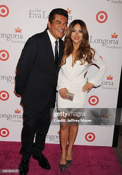 Actor George Lopez and Jackie Guerrido arrive at the Eva Longoria Foundation Dinner at Beso restaurant on September 28, 2013 in Hollywood, California.
