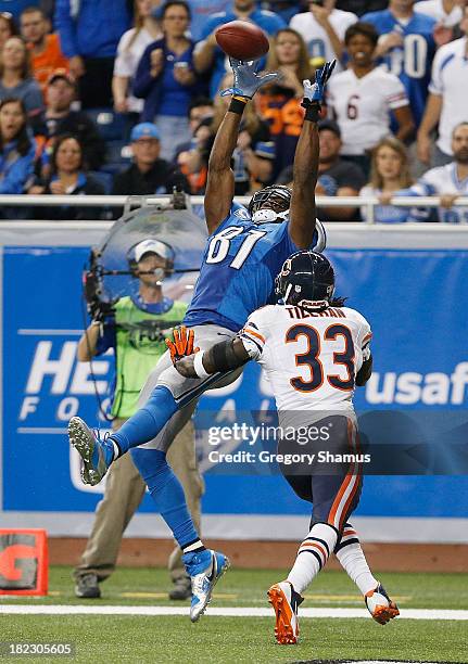 Calvin Johnson of the Detroit Lions catches a second-quarter touchdown pass in front of Charles Tillman of the Chicago Bears at Ford Field on...