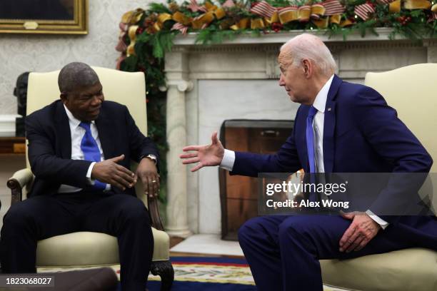 President Joe Biden shakes hands with President Joao Lourenco of Angola during a meeting in the Oval Office of the White House on November 30, 2023...