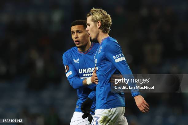Todd Cantwell of Rangers is consoled by teammate James Tavernier as he is substituted during the UEFA Europa League match between Rangers FC and Aris...