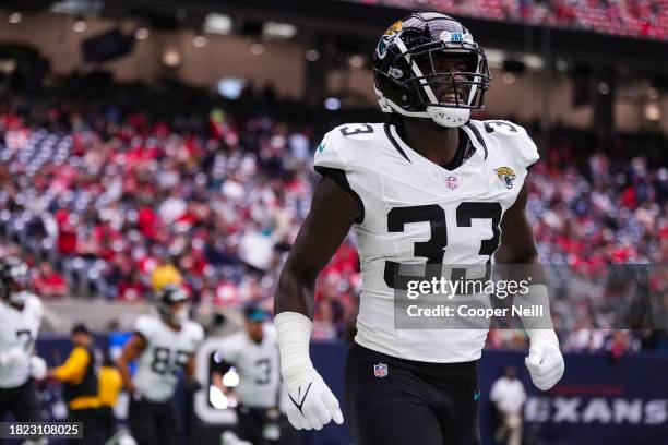 Devin Lloyd of the Jacksonville Jaguars runs out of the tunnel prior to an NFL football game against the Houston Texans at NRG Stadium on November...