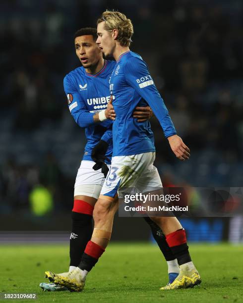 Todd Cantwell of Rangers is consoled by teammate James Tavernier as he is substituted off during the UEFA Europa League match between Rangers FC and...