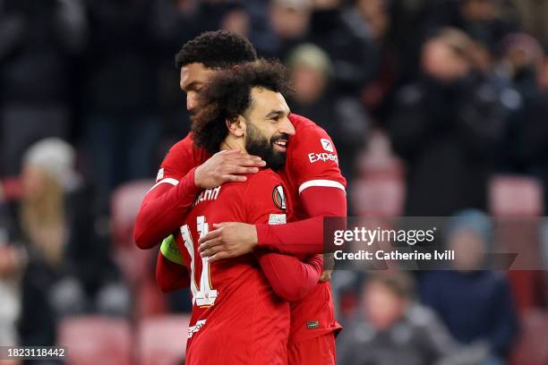 Mohamed Salah of Liverpool celebrates with teammate Joe Gomez after scoring the team's third goal from the penalty spot during the UEFA Europa League...