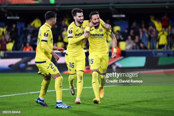 Jose Luis Morales of Villarreal CF celebrates with teammates Alex Baena and Ilias Akhomach after scoring the team's third goal during the UEFA Europa...