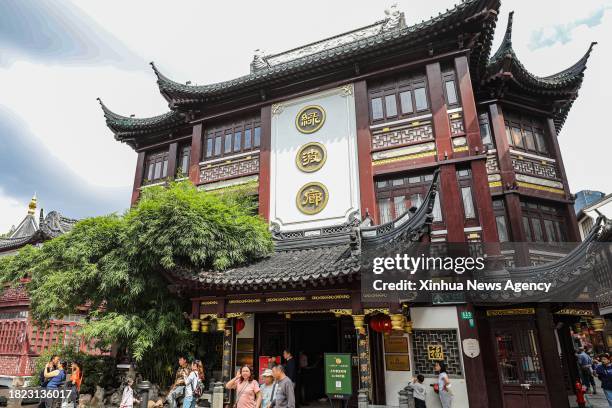 This photo taken on Oct. 12, 2023 shows tourists visiting Yuyuan Garden in east China's Shanghai. Yuyuan Garden, a cultural beacon of Shanghai, is...