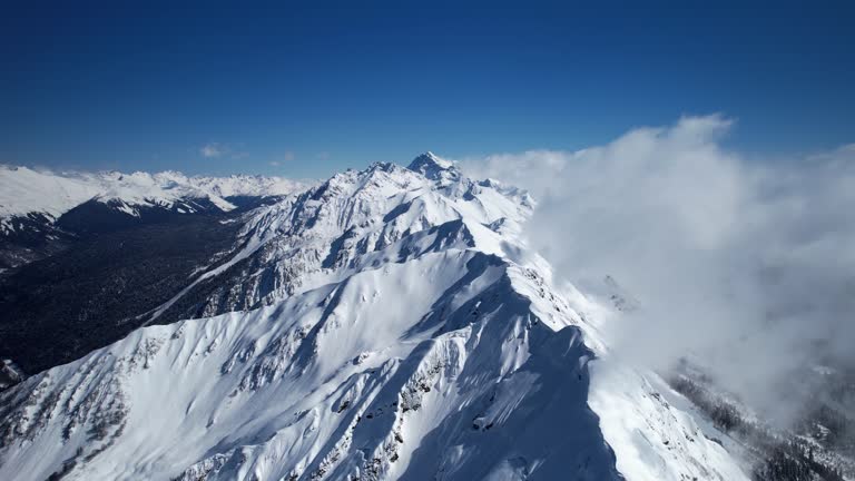 Snow Capped Ridge Beautiful view of the mountain range. Snow-capped mountains. The ...
