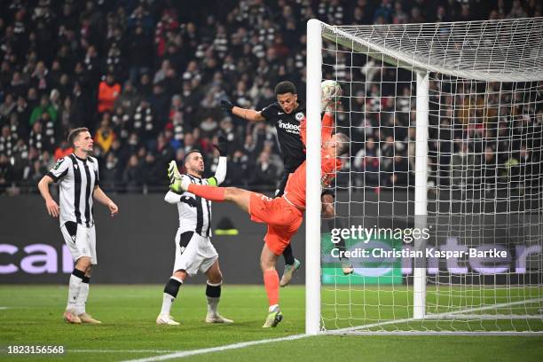 Dominik Kotarski of PAOK FC makes a save against Tuta of Eintracht Frankfurt during the UEFA Europa Conference League match between Eintracht...